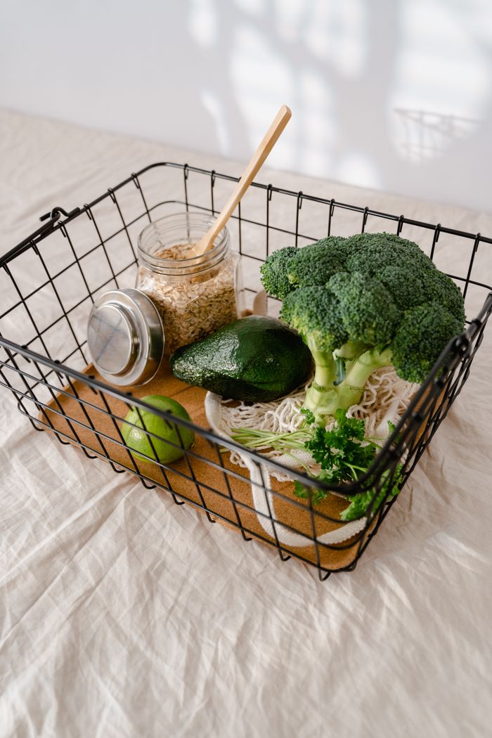 The Art of Drawing Readers In: Your attractive post title goes here Fresh broccoli, avocado, and oats ready for healthy meal preparations in a wire basket.